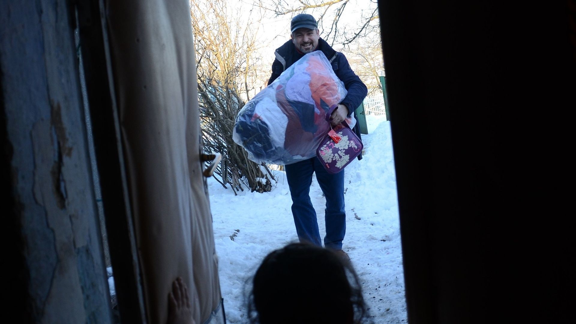 Man carrying bag with clothing